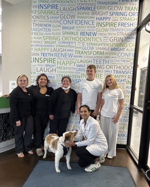 The Spring Orthodontics team with the therapy dog