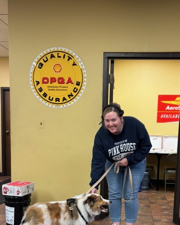 A staff member with the therapy dog during the Keller-Heartt visit